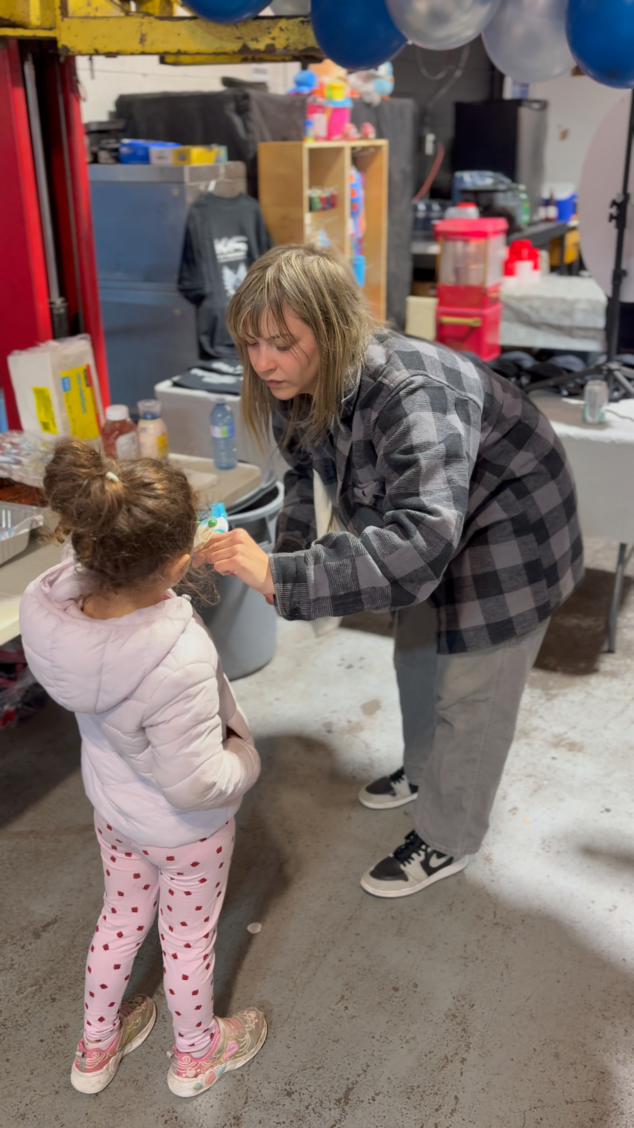 Mom feeding her daughter